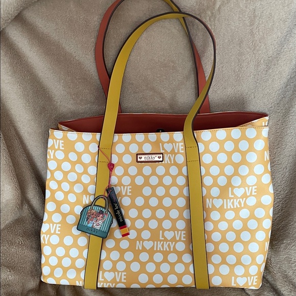 Nicole Lee Handbags - Nicole Lee Yellow Polka Dot Tote with pink polka dots and brown Interior